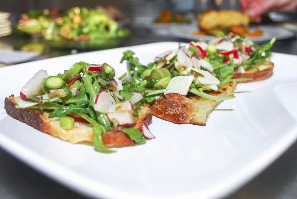 At the Wallace House, chef Katie Porter prepares delicious fruit- and veggie-forward dishes, like this loaded crostini. (Courtesy of The Wallace Centers of Iowa)